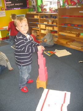 Using a peice of Montessori equipment