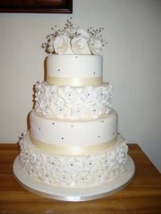 wedding cake with diamantes and sugar flowers
