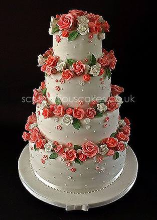A 4 tier cake with sugar roses