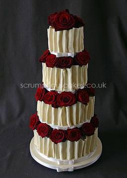 A 4 tier white chocolate rap with roses