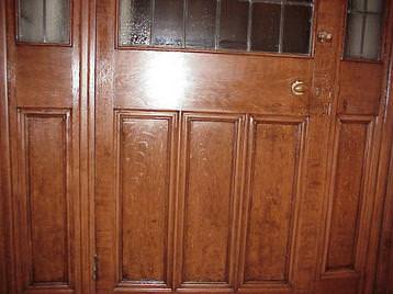 Oak grained door on staircase