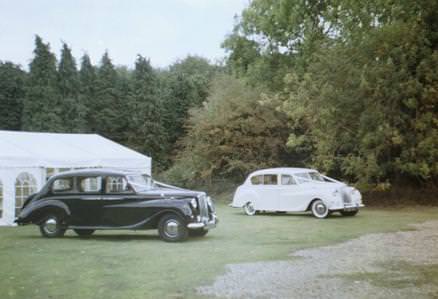 Our black and our white Vanden Plas limousine