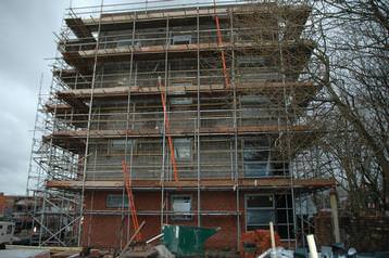 an apartment block nearing completion