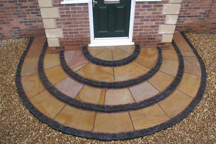 large circular 4 tier step with cobble riser