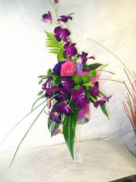 Purple orchid wedding flower arrangement