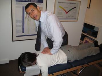 Dr Brian performing an Adjustment