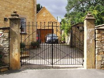 Refurbished iron gates and stone gate posts