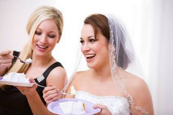 A beautiful bride enjoying her cake