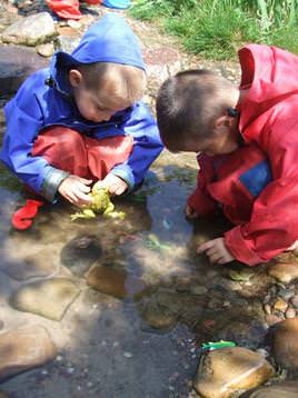 Children playing in outdoor water feature