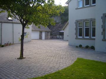 A reclaimed granite sett driveway & paving