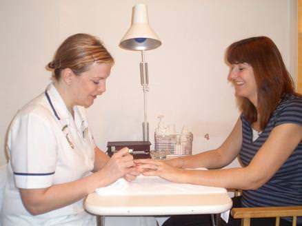 Client having a manicure